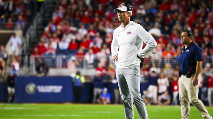 Nov 15, 2025; Oxford, Mississippi, USA; Mississippi Rebels head coach Lane Kiffin reacts to a play against the Florida Gators during the first half at Vaught-Hemingway Stadium. Mandatory Credit: Petre Thomas-Imagn Images Nov 15, 2025; Oxford, Mississippi, USA; Mississippi Rebels head coach Lane Kiffin reacts to a play against the Florida Gators during the first half at Vaught-Hemingway Stadium. Mandatory Credit: Petre Thomas-Imagn Images