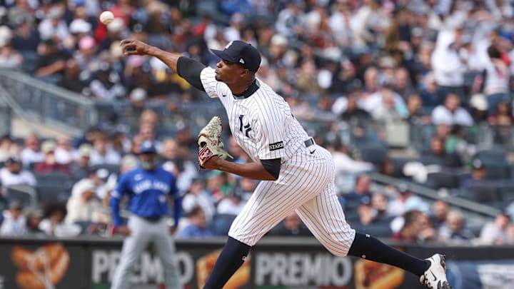 Apr 27, 2025; Bronx, New York, USA; New York Yankees relief pitcher Yerry de los Santos (73) delivers a pitch during the seventh inning against the Toronto Blue Jays at Yankee Stadium. Mandatory Credit: Vincent Carchietta-Imagn Images