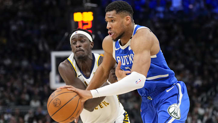 Mar 15, 2025; Milwaukee, Wisconsin, USA;  Milwaukee Bucks forward Giannis Antetokounmpo (34) drives for the basket against Indiana Pacers forward Pascal Siakam (43) during the third quarter at Fiserv Forum. Mandatory Credit: Jeff Hanisch-Imagn Images