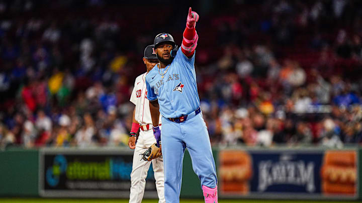Aug 29, 2024; Boston, Massachusetts, USA; Toronto Blue Jays designated hitter Vladimir Guerrero Jr. (27) reacts after hitting a double to drive in a run against the Boston Red Sox  in the third inning at Fenway Park.