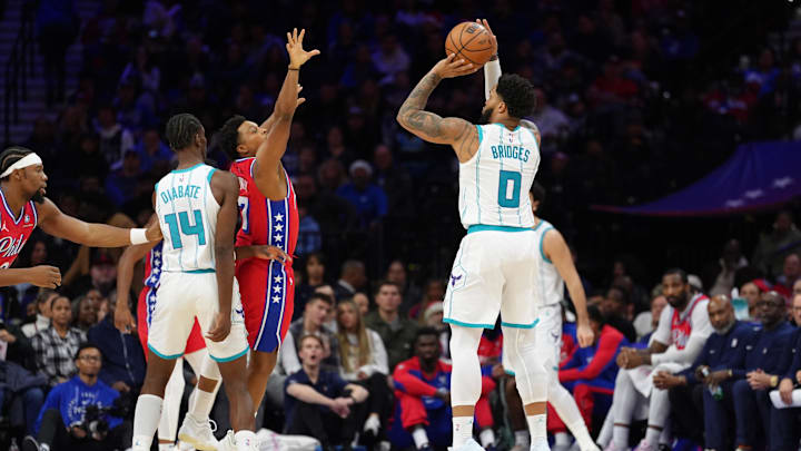 Dec 20, 2024; Philadelphia, Pennsylvania, USA; Charlotte Hornets forward Miles Bridges (0) shoots the ball against the Philadelphia 76ers in the fourth quarter at Wells Fargo Center. Mandatory Credit: Kyle Ross-Imagn Images