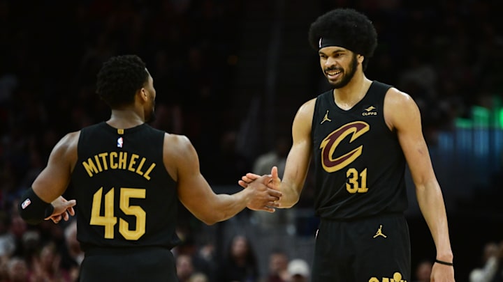 Apr 10, 2024; Cleveland, Ohio, USA; Cleveland Cavaliers guard Donovan Mitchell (45) and center Jarrett Allen (31) celebrate during the second half against the Memphis Grizzlies at Rocket Mortgage FieldHouse. Mandatory Credit: Ken Blaze-Imagn Images