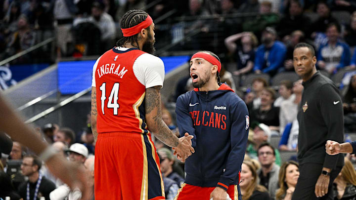 Feb 2, 2023; Dallas, Texas, USA; New Orleans Pelicans guard Jose Alvarado (15) celebrates as forward Brandon Ingram (14) comes off the court during the second half of the game against the Dallas Mavericks at the American Airlines Center. Mandatory Credit: Jerome Miron-Imagn Images Feb 2, 2023; Dallas, Texas, USA; New Orleans Pelicans guard Jose Alvarado (15) celebrates as forward Brandon Ingram (14) comes off the court during the second half of the game against the Dallas Mavericks at the American Airlines Center. Mandatory Credit: Jerome Miron-Imagn Images