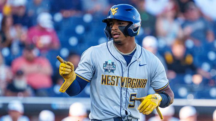 Jun 14, 2026; Omaha, NE, USA; West Virginia Mountaineers first baseman Armani Guzman (5) points to the dugout after being walked in the first inning against the North Carolina Tar Heels at Charles Schwab Field. Mandatory Credit: Dylan Widger-Imagn Images Jun 14, 2026; Omaha, NE, USA; West Virginia Mountaineers first baseman Armani Guzman (5) points to the dugout after being walked in the first inning against the North Carolina Tar Heels at Charles Schwab Field. Mandatory Credit: Dylan Widger-Imagn Images
