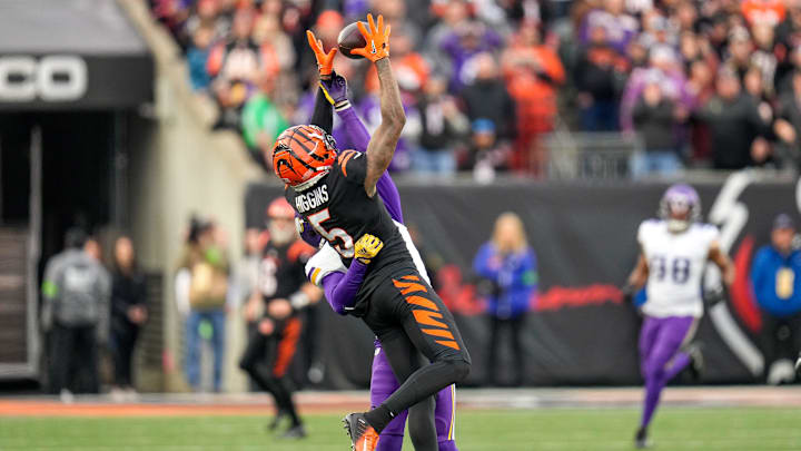 Minnesota Vikings cornerback Akayleb Evans (21) breaks up a deep pass intended for Cincinnati
