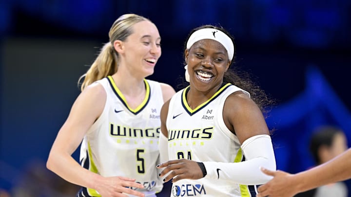 Dallas Wings guard Paige Bueckers and guard Arike Ogunbowale celebrate during the second half against the New York Liberty at College Park Center.