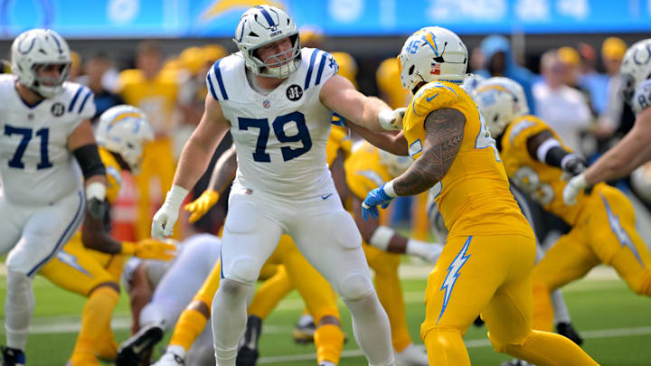 Oct 19, 2025; Inglewood, California, USA; Indianapolis Colts offensive tackle Bernhard Raimann (79) blocks Los Angeles Chargers linebacker Tuli Tuipulotu (45) in the first half at SoFi Stadium. Mandatory Credit: Jayne Kamin-Oncea-Imagn Images