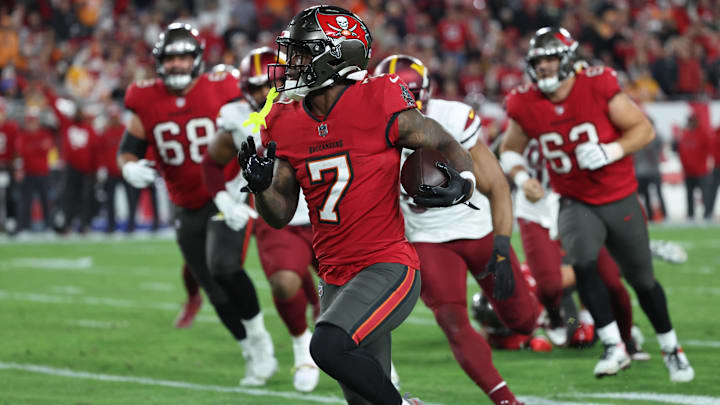 Jan 12, 2025; Tampa, Florida, USA; Tampa Bay Buccaneers running back Bucky Irving (7) runs during the third quarter of a NFC wild card playoff against the Washington Commanders at Raymond James Stadium. Mandatory Credit: Kim Klement Neitzel-Imagn Images Jan 12, 2025; Tampa, Florida, USA; Tampa Bay Buccaneers running back Bucky Irving (7) runs during the third quarter of a NFC wild card playoff against the Washington Commanders at Raymond James Stadium. Mandatory Credit: Kim Klement Neitzel-Imagn Images