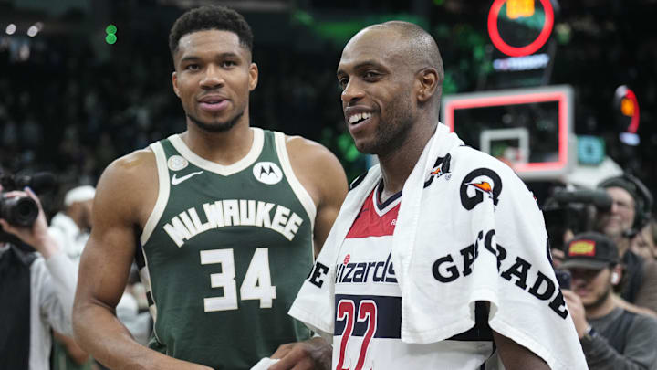 Oct 22, 2025; Milwaukee, Wisconsin, USA; Milwaukee Bucks forward Giannis Antetokounmpo (34) and Washington Wizards forward Khris Middleton (22), former teammates, talk to each other after their game at Fiserv Forum. Mandatory Credit: Michael McLoone-Imagn Images