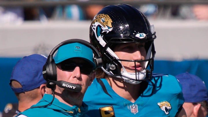 Jacksonville Jaguars head coach Liam Coen talks with Jacksonville Jaguars quarterback Trevor Lawrence (16) during the first quarter during an NFL football game at EverBank Stadium, Sunday, Dec. 14, 2025, in Jacksonville, Fla. [Doug Engle/Florida Times-Union]