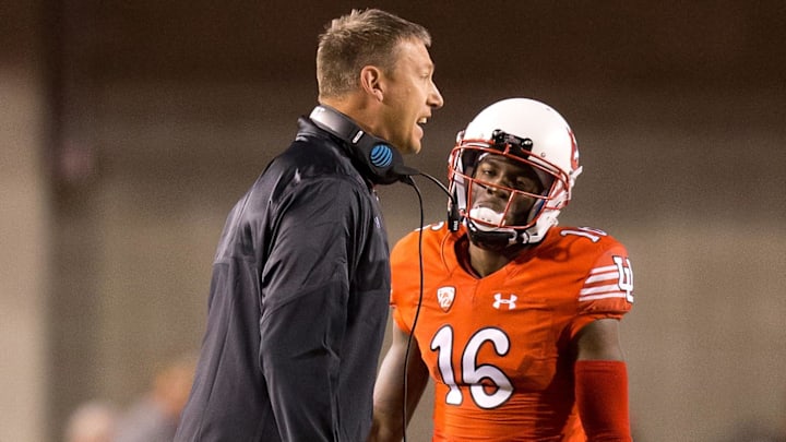 Oct 8, 2016; Salt Lake City, UT, USA; Utah Utes co-offensive coordinator Jim Harding talks to his players during a time out in the first half against the Arizona Wildcats at Rice-Eccles Stadium. Mandatory Credit: Russ Isabella-Imagn Images