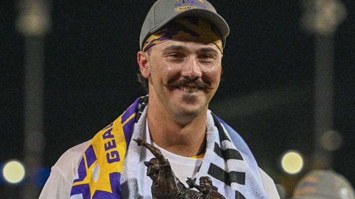 Jun 26, 2023; Omaha, NE, USA;  LSU Tigers pitcher Paul Skenes (20) accepts the Most Outstanding