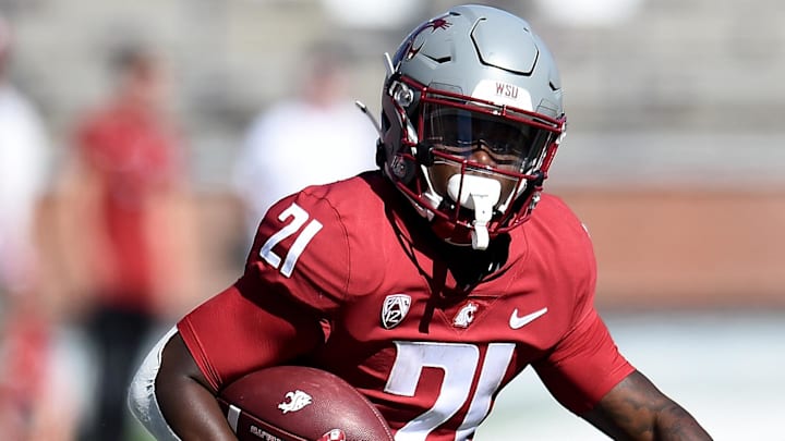 Aug 31, 2024; Pullman, Washington, USA; Washington State Cougars running back Wayshawn Parker (21) carries the ball against the Portland State Vikings in the second half at Gesa Field at Martin Stadium
