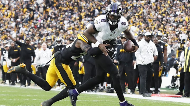 Pittsburgh Steelers cornerback Joey Porter Jr. (24) stops Baltimore Ravens quarterback Lamar Jackson (8) short of the end-zone on a two-point conversion attempt during the fourth quarter at Acrisure Stadium. 