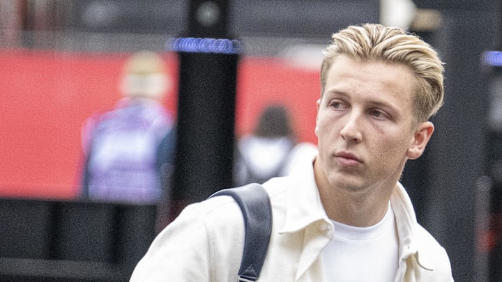Oct 18, 2024; Austin, Texas, USA; Visa Cash App RB Formula One Team driver Liam Lawson (30) of Team New Zealand walks through the track entrance before practice for the 2024 US Grand Prix at Circuit of the Americas. Mandatory Credit: Jerome Miron-Imagn Images