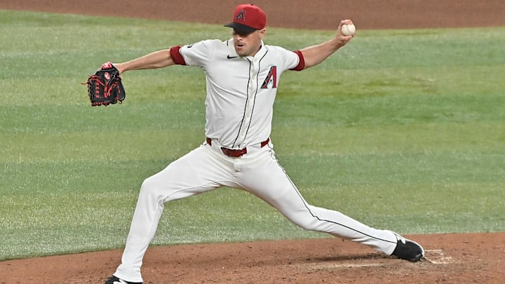 Mar 28, 2025; Phoenix, Arizona, USA;  Arizona Diamondbacks pitcher Joe Mantiply (35) throws in the seventh inning against the Chicago Cubs at Chase Field. 