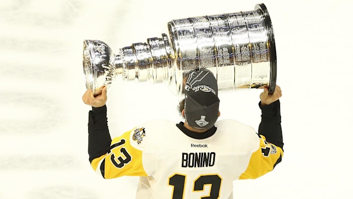 Pittsburgh Penguins center Nick Bonino skates with the Stanley Cup after defeating the Nashville Predators.