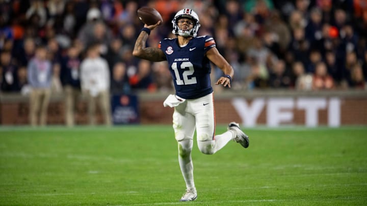 Auburn Tigers quarterback Ashton Daniels (12) pump fakes a pass as Auburn Tigers take on Kentucky Wildcats at Jordan-Hare Stadium in Auburn, Ala. on Saturday, Nov. 1, 2025. Auburn Tigers and Kentucky Wildcats are tied 3-3 at halftime. Auburn Tigers quarterback Ashton Daniels (12) pump fakes a pass as Auburn Tigers take on Kentucky Wildcats at Jordan-Hare Stadium in Auburn, Ala. on Saturday, Nov. 1, 2025. Auburn Tigers and Kentucky Wildcats are tied 3-3 at halftime.