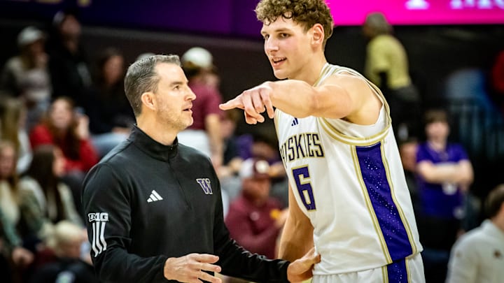 Danny Sprinkle and Hannes Steinbach confer on the sideline. 