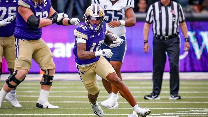 Trez Davis heads upfield after making a catch against Utah State.