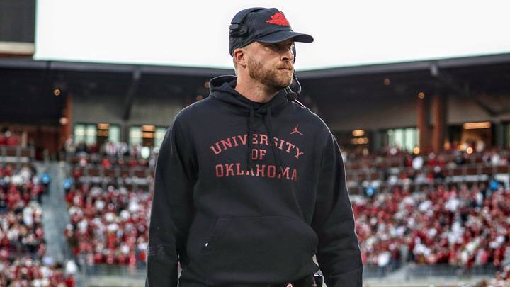Oklahoma offensive coordinator Ben Arbuckle walks onto the field before facing Kentucky. Oklahoma offensive coordinator Ben Arbuckle walks onto the field before facing Kentucky.