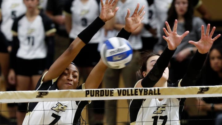 Purdue Boilermakers Raven Colvin (7) and Purdue Boilermakers Eva Hudson (17) defend a spike Purdue Boilermakers Raven Colvin (7) and Purdue Boilermakers Eva Hudson (17) defend a spike