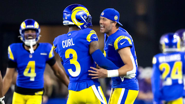 Jan 13, 2025; Glendale, AZ, USA; Los Angeles Rams quarterback Matthew Stafford (9) celebrates a touchdown with safety Kamren Curl (3) against the Minnesota Vikings during an NFC wild card game at State Farm Stadium. Mandatory Credit: Mark J. Rebilas-Imagn Images