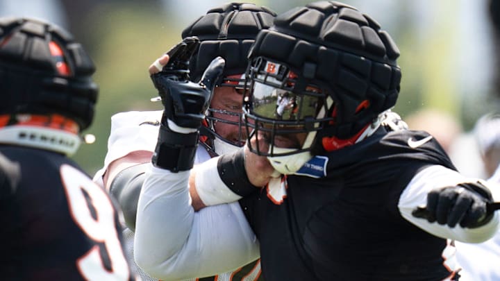 Cincinnati Bengals guard Alex Cappa (65) blocks Cincinnati Bengals defensive tackle Sheldon Rankins (98) during Cincinnati Bengals training camp in Cincinnati on Friday, July 26, 2024.