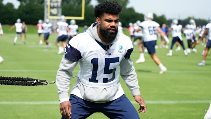 Jun 5, 2024; Frisco, TX, USA;  Dallas Cowboys running back Ezekiel Elliott (15) goes through a drill during practice at the Ford Center at the Star Training Facility in Frisco, Texas. Mandatory Credit: Chris Jones-USA TODAY Sports