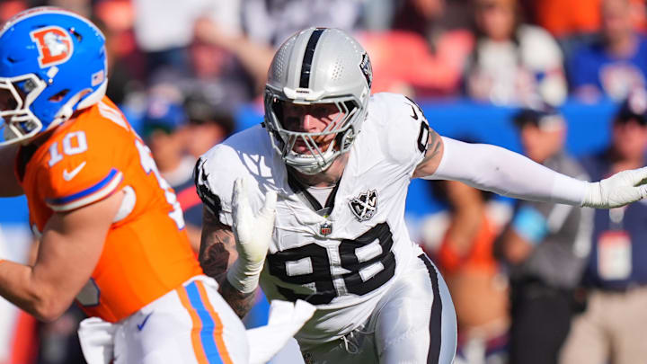 Oct 6, 2024; Denver, Colorado, USA; Las Vegas Raiders defensive end Maxx Crosby (98) chases down Denver Broncos quarterback Bo Nix (10) for a sack in the second half at Empower Field at Mile High. 