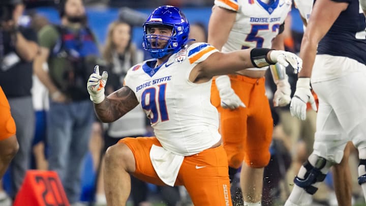 Dec 31, 2024; Glendale, AZ, USA; Boise State Broncos defensive end Ahmed Hassanein (91) celebrates a play against the Penn State Nittany Lions during the Fiesta Bowl at State Farm Stadium. Mandatory Credit: Mark J. Rebilas-Imagn Images