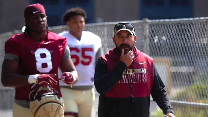 FSU football players and coaches walk into the first spring practice of the spring season on Wednesday, March 19, 2025