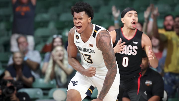 Nov 27, 2024; Paradise Island, Bahamas, BHS; West Virginia Mountaineers forward Amani Hansberry (13) reacts in front of Gonzaga Bulldogs guard Ryan Nembhard (0) during the second half at the Atlantis Resort. Mandatory Credit: Kevin Jairaj-Imagn Images Nov 27, 2024; Paradise Island, Bahamas, BHS; West Virginia Mountaineers forward Amani Hansberry (13) reacts in front of Gonzaga Bulldogs guard Ryan Nembhard (0) during the second half at the Atlantis Resort. Mandatory Credit: Kevin Jairaj-Imagn Images