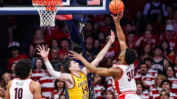 Jan 14, 2026; Tucson, Arizona, USA; Arizona Wildcats forward Tobe Awaka (30) makes a lay up over Arizona State Sun Devils forward Andrija Grbovi? (14) during the first half of the game at McKale Memorial Center. Mandatory Credit: Aryanna Frank-Imagn Images Jan 14, 2026; Tucson, Arizona, USA; Arizona Wildcats forward Tobe Awaka (30) makes a lay up over Arizona State Sun Devils forward Andrija Grbovi? (14) during the first half of the game at McKale Memorial Center. Mandatory Credit: Aryanna Frank-Imagn Images