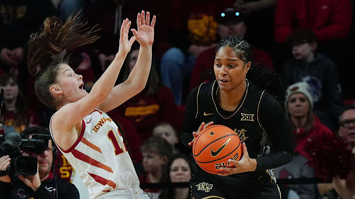 Iowa State Cyclones' guard Kenzie Hare (12) put high pressure on UCF Knights forward Mahogany Chandler-Roberts (33) and gets offensive foul during the first quarter in the Big-12 women’s basketball on Jan. 31, 2026, at Hilton Coliseum in Ames, Iowa.