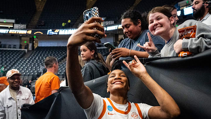 Texas Longhorns forward Madison Booker (35) takes photos with fans after winning the NCAA Playoff Regional semi-final game against the Tennessee Lady Vols 59-67 at Legacy Arena in Birmingham Alabama, March 29, 2025. The Longhorns will advance to the Elite Eight round, playing against TCU in the Regional Finals on Monday.