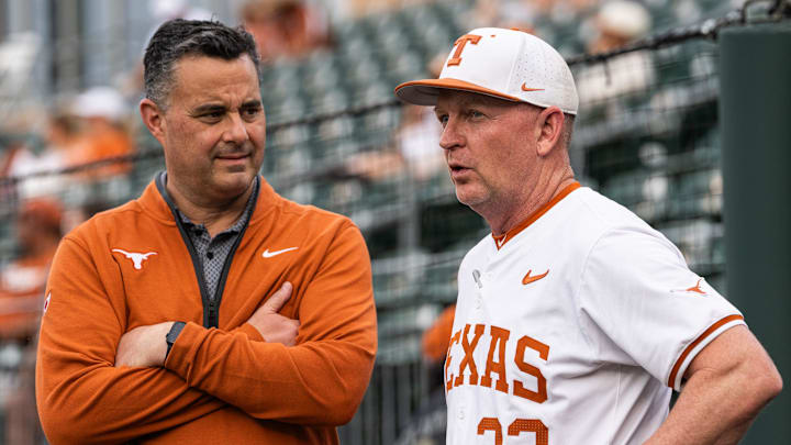 Texas Basketball coach Sean Miller chats with Texas Baseball coach Jim Schlossnagle as the Longhorns prepare to take on the Auburn Tigers in the first game of a three-game series on Thursday night at UFCU Disch-Falk Field in Austin, April 17, 2025.