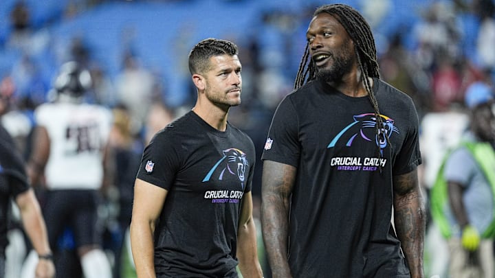 Oct 13, 2024; Charlotte, North Carolina, USA; Carolina Panthers head coach Dave Canales talks with linebacker Jadeveon Clowney (7) after the second half against the Atlanta Falcons at Bank of America Stadium. 