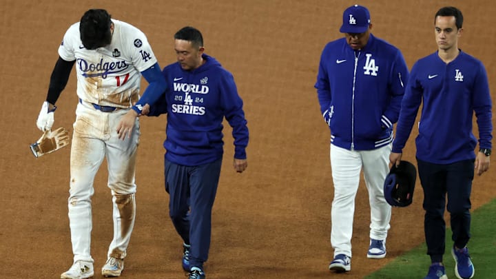 Oct 26, 2024; Los Angeles, California, USA; Los Angeles Dodgers designated hitter Shohei Ohtani (17) walks off the field after injuring his shoulder against the New York Yankees in the seventh inning for game two of the 2024 MLB World Series at Dodger Stadium. Mandatory Credit: Kiyoshi Mio-Imagn Images Oct 26, 2024; Los Angeles, California, USA; Los Angeles Dodgers designated hitter Shohei Ohtani (17) walks off the field after injuring his shoulder against the New York Yankees in the seventh inning for game two of the 2024 MLB World Series at Dodger Stadium. Mandatory Credit: Kiyoshi Mio-Imagn Images