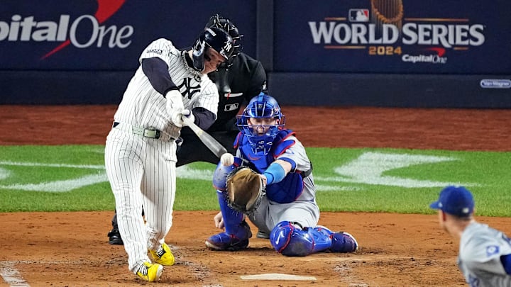 Oct 30, 2024; New York, New York, USA; New York Yankees outfielder Alex Verdugo (24) hits an RBI single during the second inning against the Los Angeles Dodgers in game four of the 2024 MLB World Series at Yankee Stadium. 