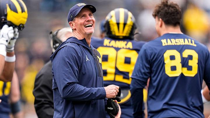 Michigan defensive coordinator Jay Hill celebrates a play during the spring game at Michigan Stadium in Ann Arbor on Saturday, April 18, 2026. Michigan defensive coordinator Jay Hill celebrates a play during the spring game at Michigan Stadium in Ann Arbor on Saturday, April 18, 2026.
