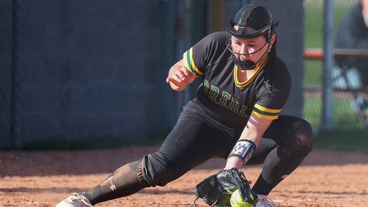 Green Bay Preble High School's Maya Darmawan (26) fields a bunt versus Ashwaubenon in a Fox River Classic Conference game on April 28, 2026. Green Bay Preble High School's Maya Darmawan (26) fields a bunt versus Ashwaubenon in a Fox River Classic Conference game on April 28, 2026.