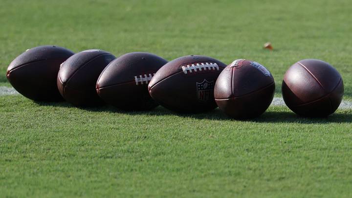 Ashburn, VA, USA; Football lay on the field at training camp at the BigBear.ai Performance Center at Commanders Park. Mandatory Credit: Geoff Burke-Imagn Images