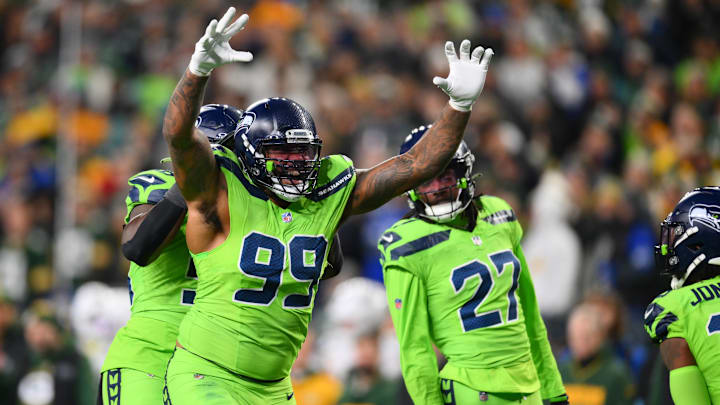 Dec 15, 2024; Seattle, Washington, USA; Seattle Seahawks defensive end Leonard Williams (99) celebrates after a defensive play against the Green Bay Packers during the second half at Lumen Field. 