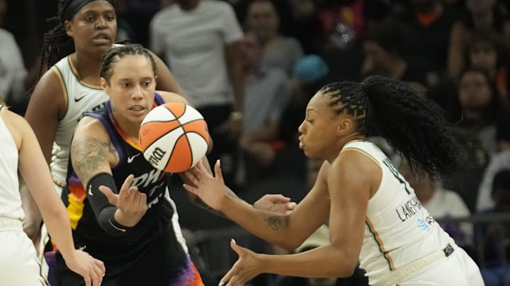 Phoenix Mercury center Brittney Griner (42) loses the ball to New York Liberty forward Betnijah Laney-Hamilton (44) during the third quarter at Footprint Center on Aug. 26, 2024, in Phoenix.