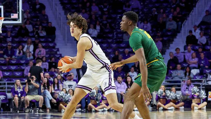 Feb 17, 2026; Manhattan, Kansas, USA; Kansas State Wildcats center Dorin Buca (22) is guarded by Baylor Bears center James Nnaji (46) during the first half at Bramlage Coliseum. Mandatory Credit: Scott Sewell-Imagn Images