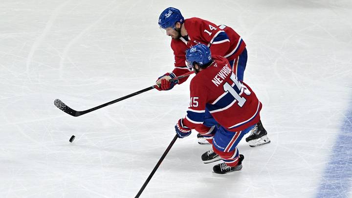 May 27, 2026; Montreal, Quebec, CAN; Montreal Canadiens center Nick Suzuki (14) and center Alex Newhook (15) skate with the puck against the Carolina Hurricanes during the third period in game four of the Eastern Conference Final of the 2026 Stanley Cup Playoffs at Bell Centre. Mandatory Credit: Eric Bolte-Imagn Images