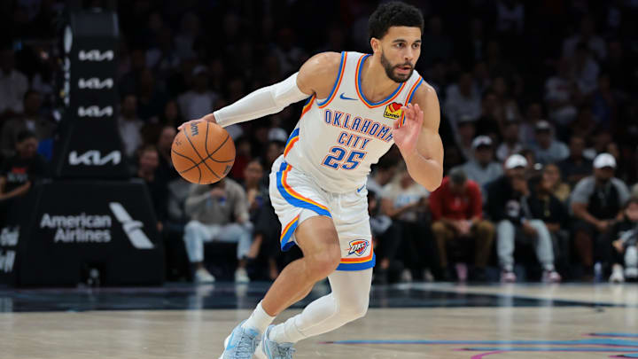 Jan 17, 2026; Miami, Florida, USA; Oklahoma City Thunder guard Ajay Mitchell (25) dribbles the basketball against the Miami Heat during the first quarter at Kaseya Center. Mandatory Credit: Sam Navarro-Imagn Images