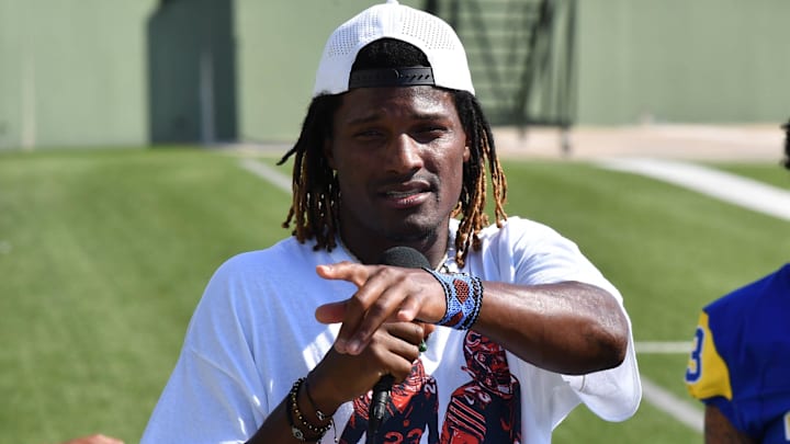 Adrian Colbert gives a talk to youth at a football camp during the summer. The HBO Hard Knocks star will be on the 53-man roster for Sunday's game.