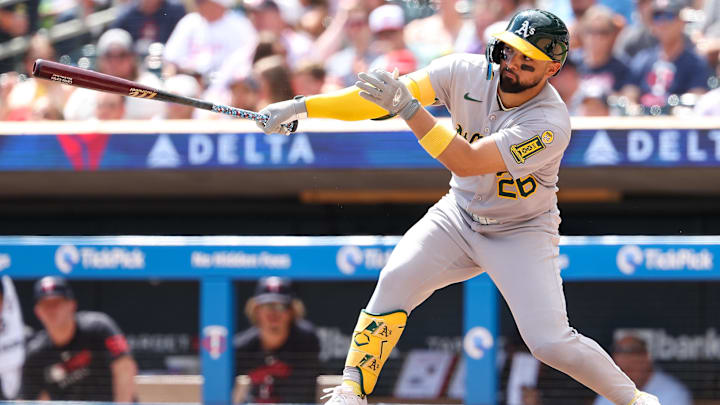Aug 21, 2025; Minneapolis, Minnesota, USA; Athletics right fielder Carlos Cortes (26) hits an RBI single against the Minnesota Twins during the second inning at Target Field. Mandatory Credit: Matt Krohn-Imagn Images